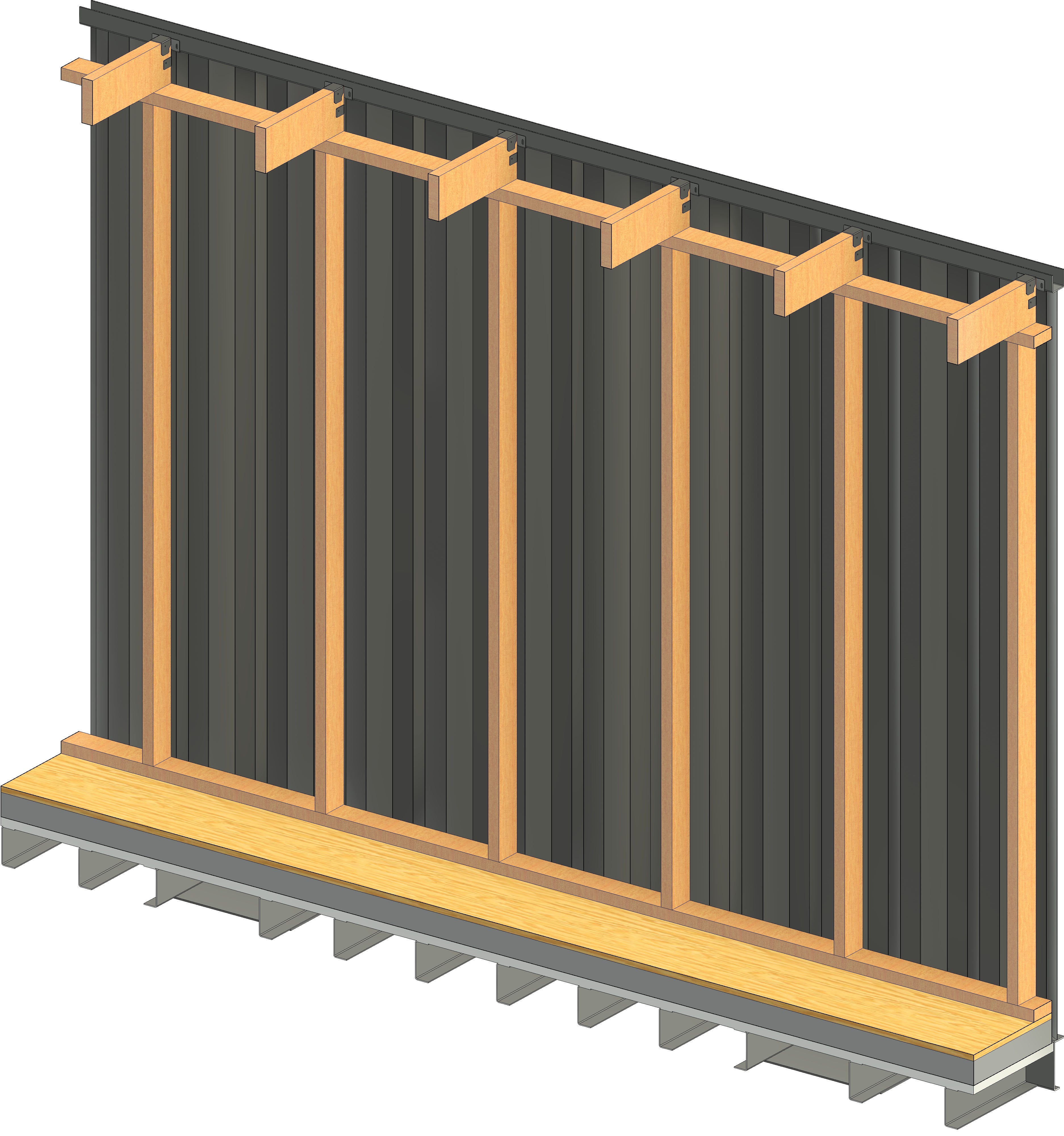 Interior view of a shipping container with vertical wood studs mounted using interior brackets along the top tubing and bottom support beams